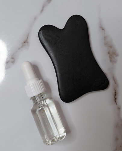 سنگ گواشا خرگوشی همراه روغن مخصوص ماساژ